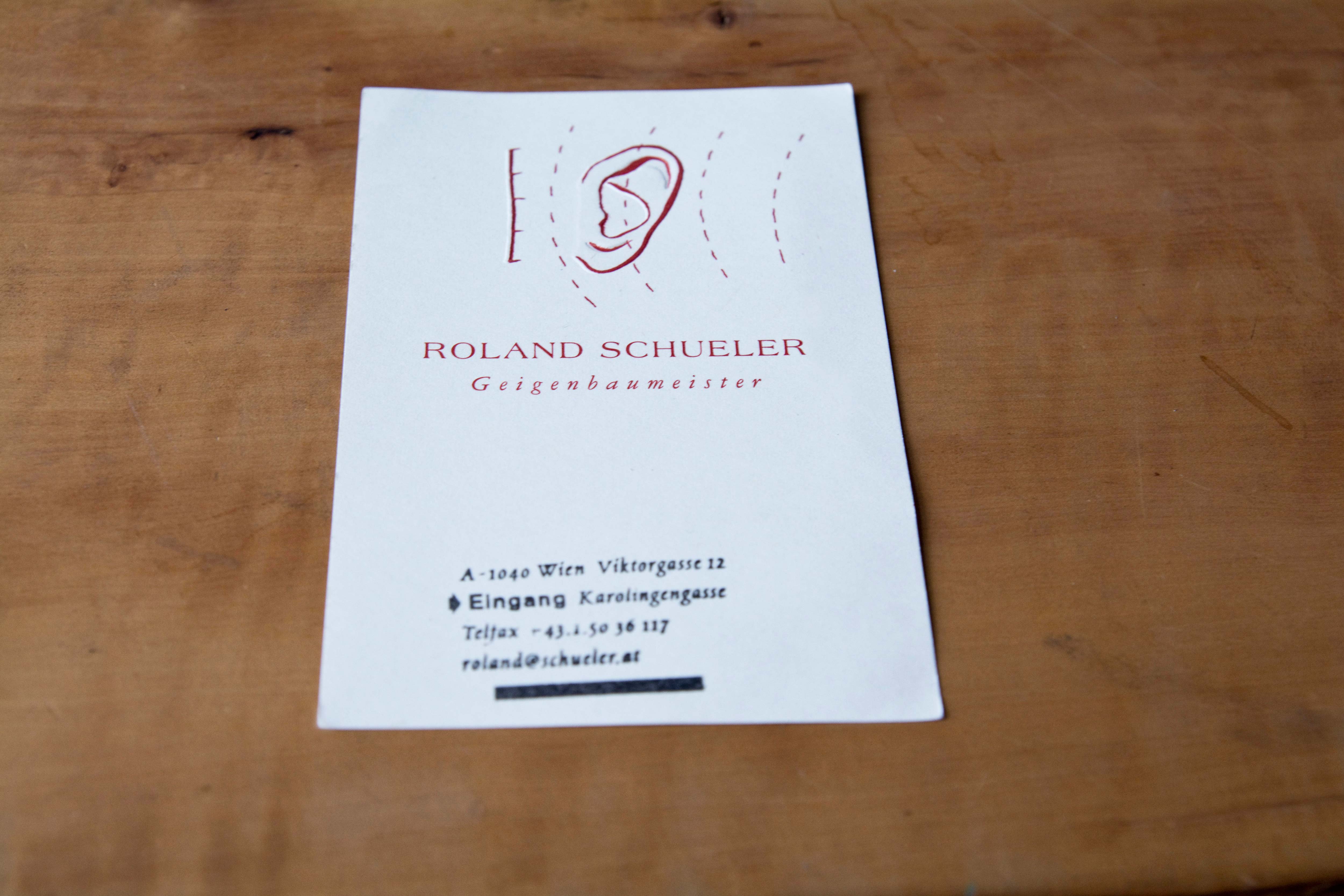 Card with partly embossed logo.