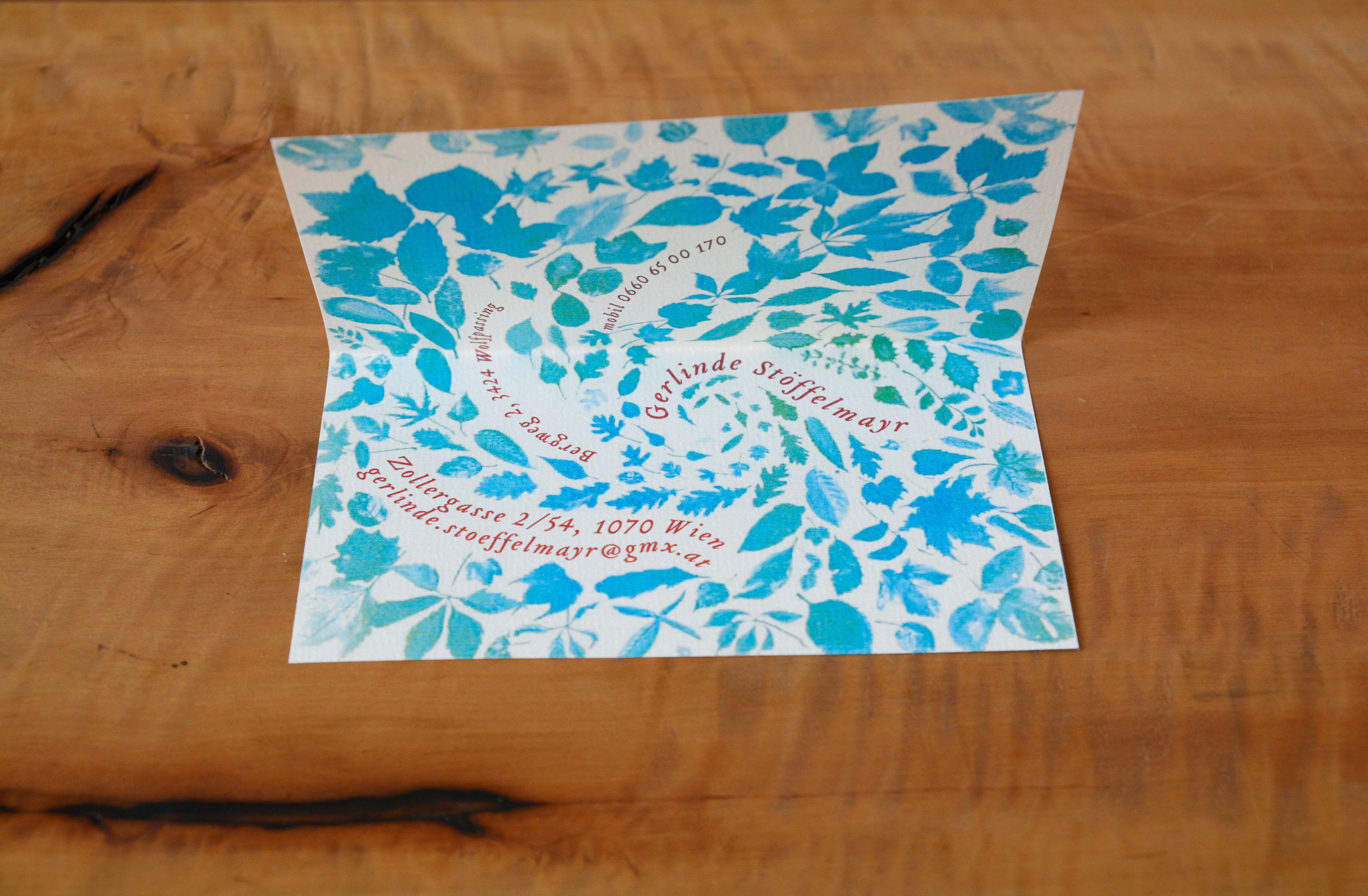 Folded card with illustrations of leaves. Text inbetween leaves.