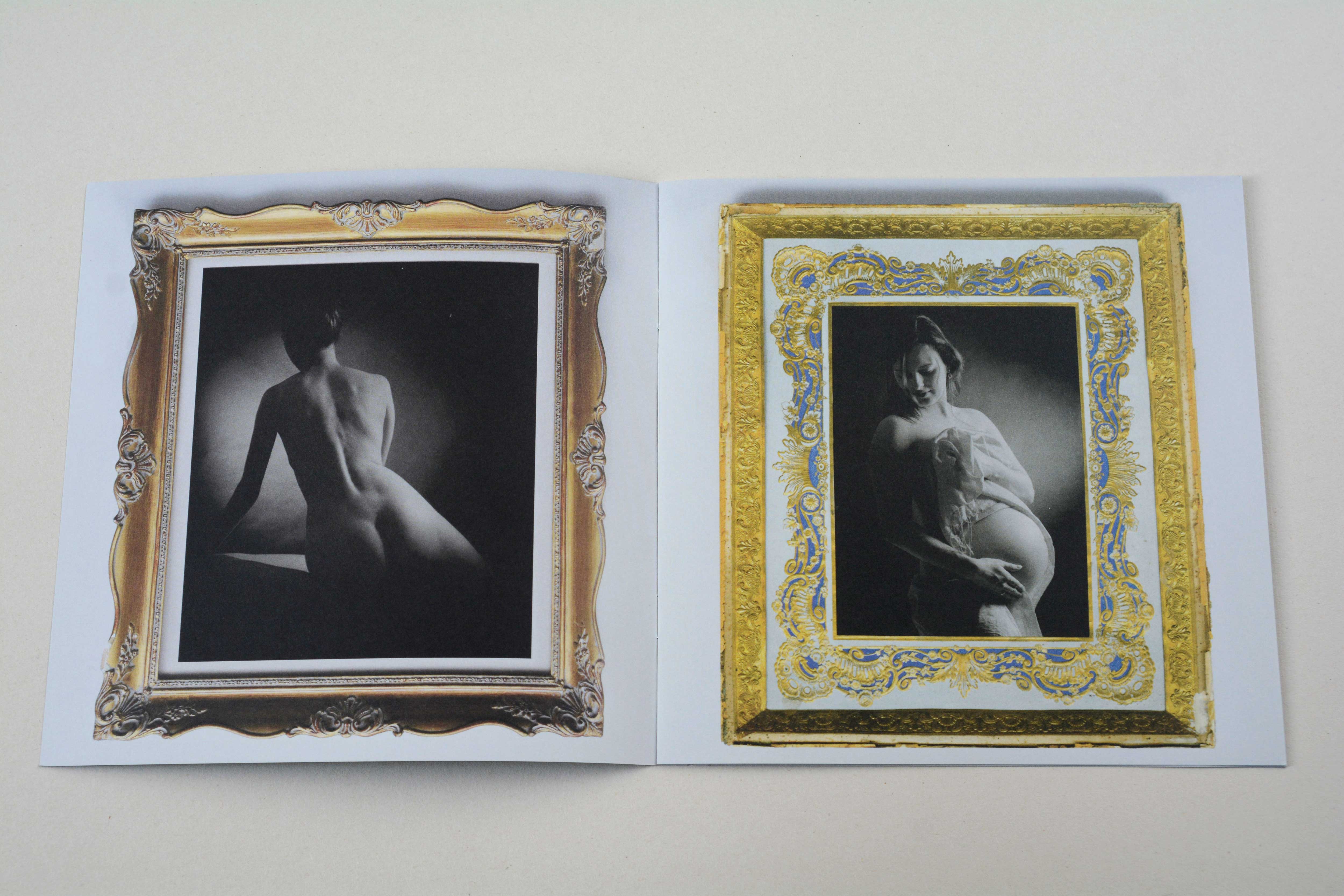 Double page. Opulent golden frame with b/w photo on each page.