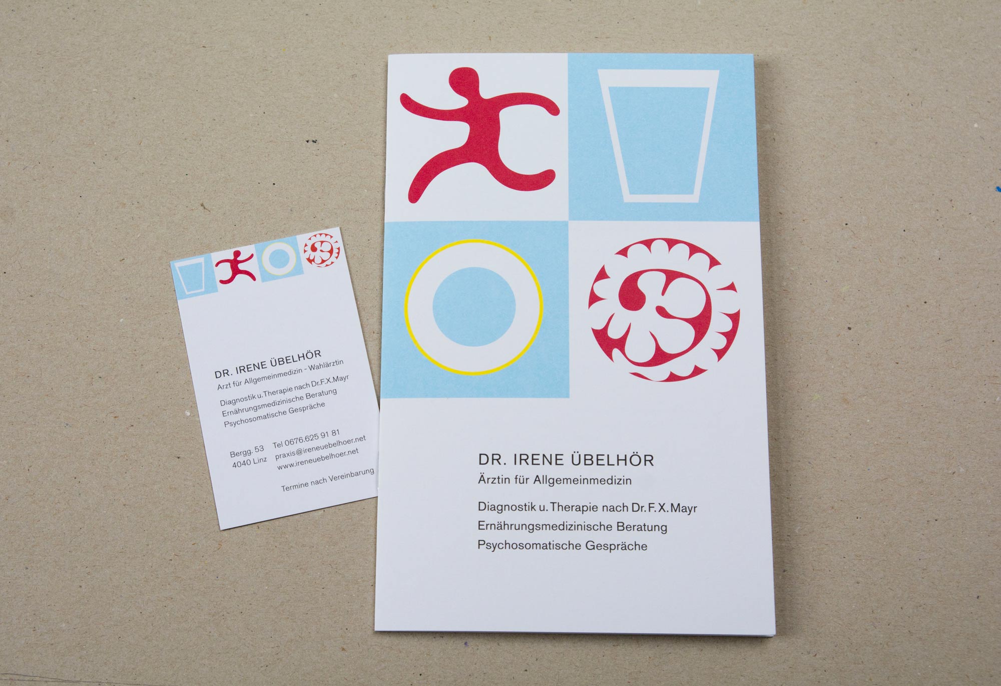 Folder and business card. 4 graphical images on top. Block of text underneath.