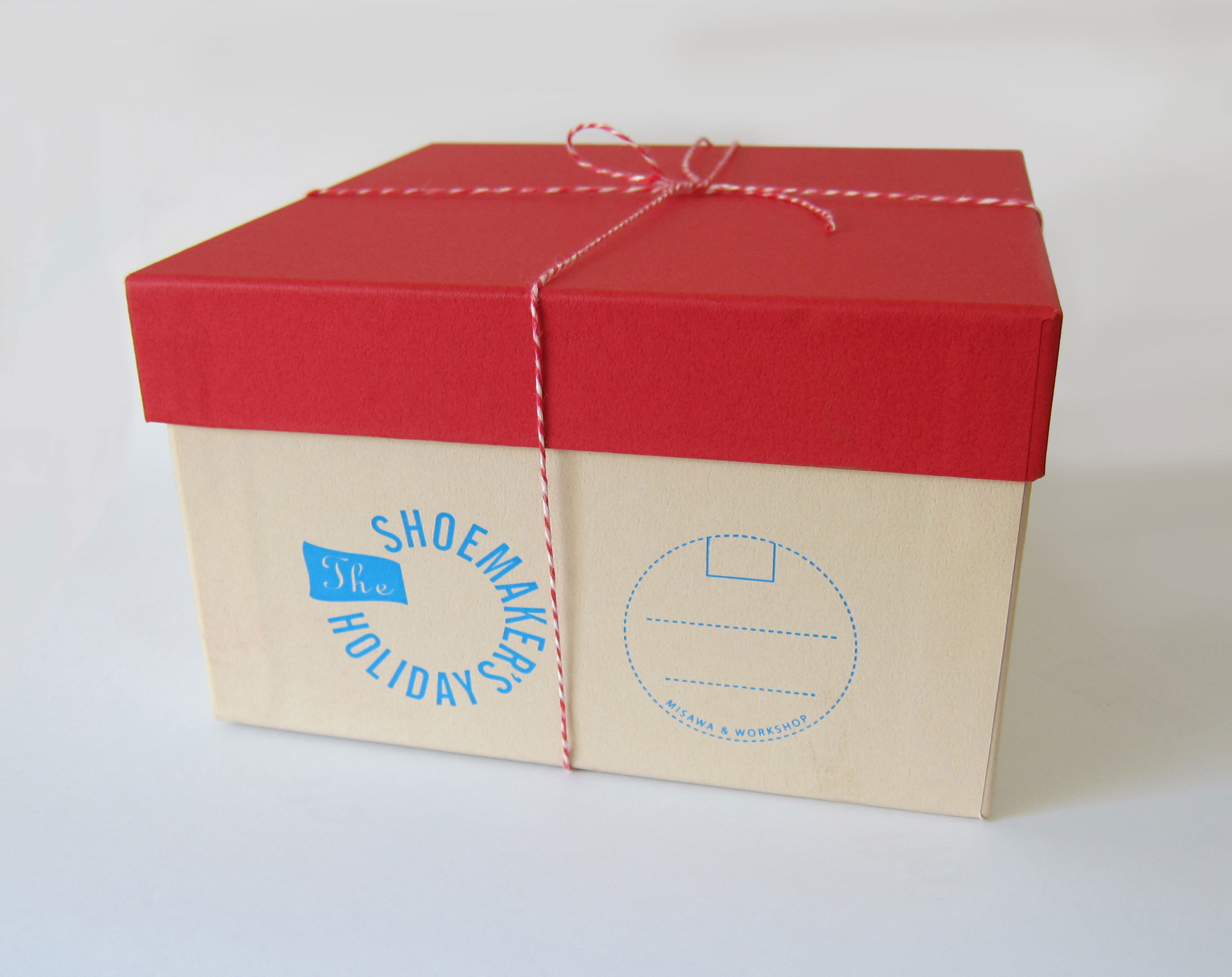 Front view of carton box with lid. Logo printed on side of box.