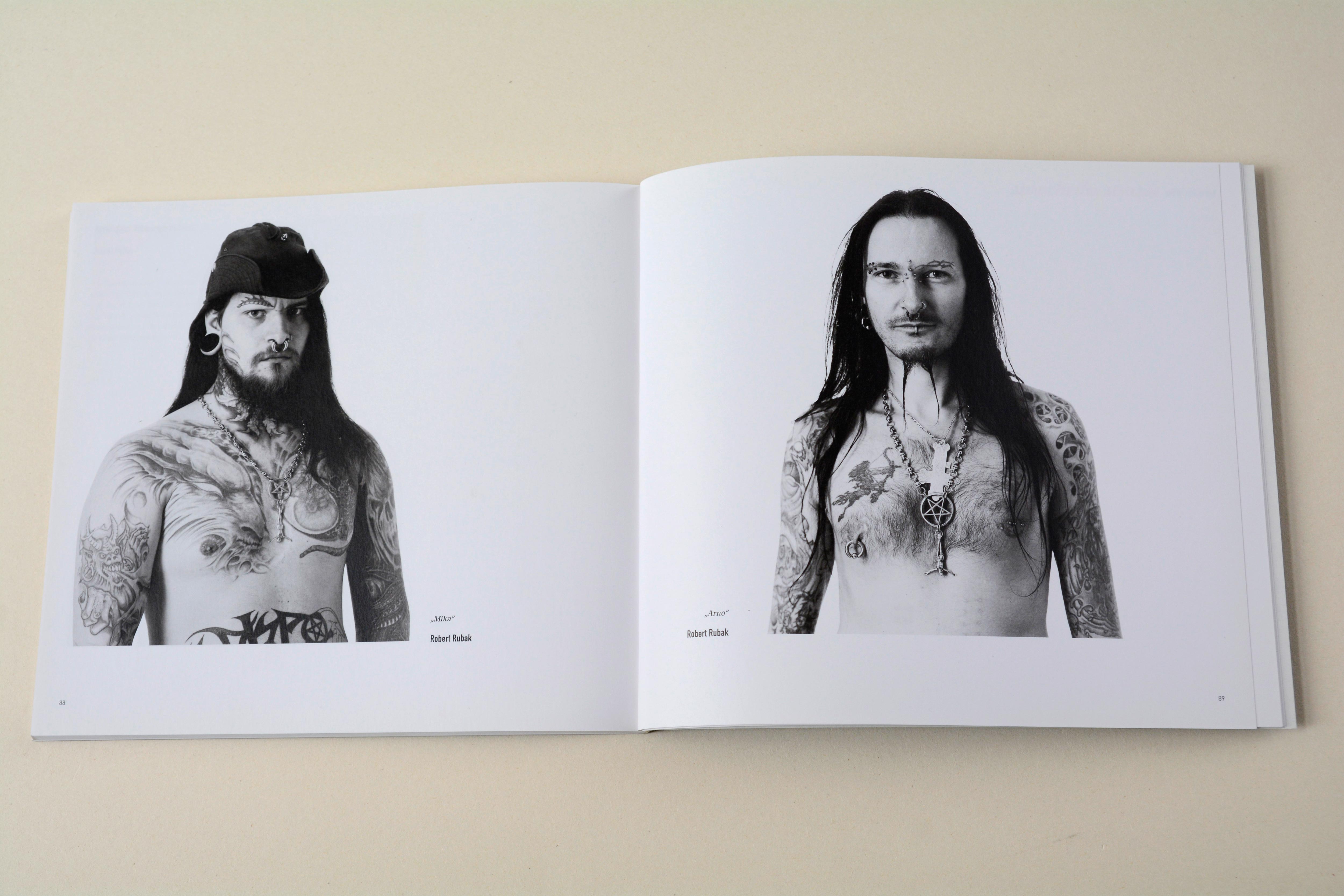 Double page. B/W photo of tattoed and pierced man on each page. Little text at bottom.
