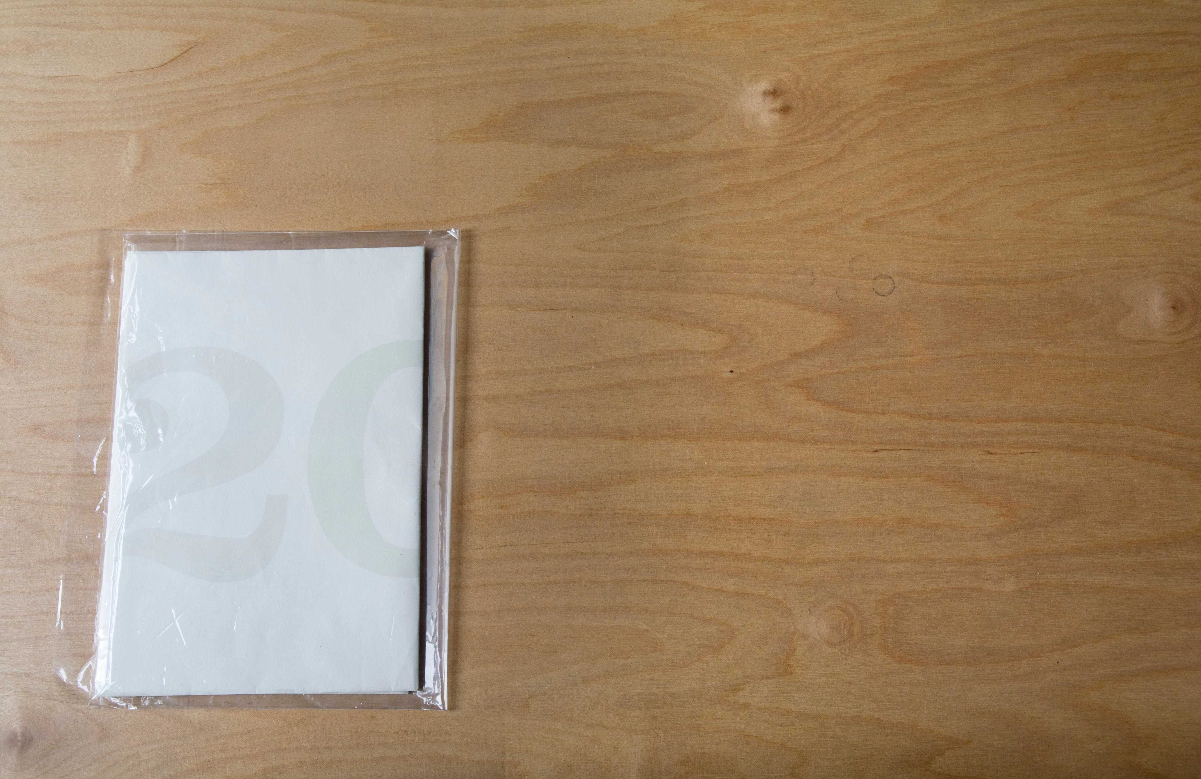 Folded mailing in plastic cover.