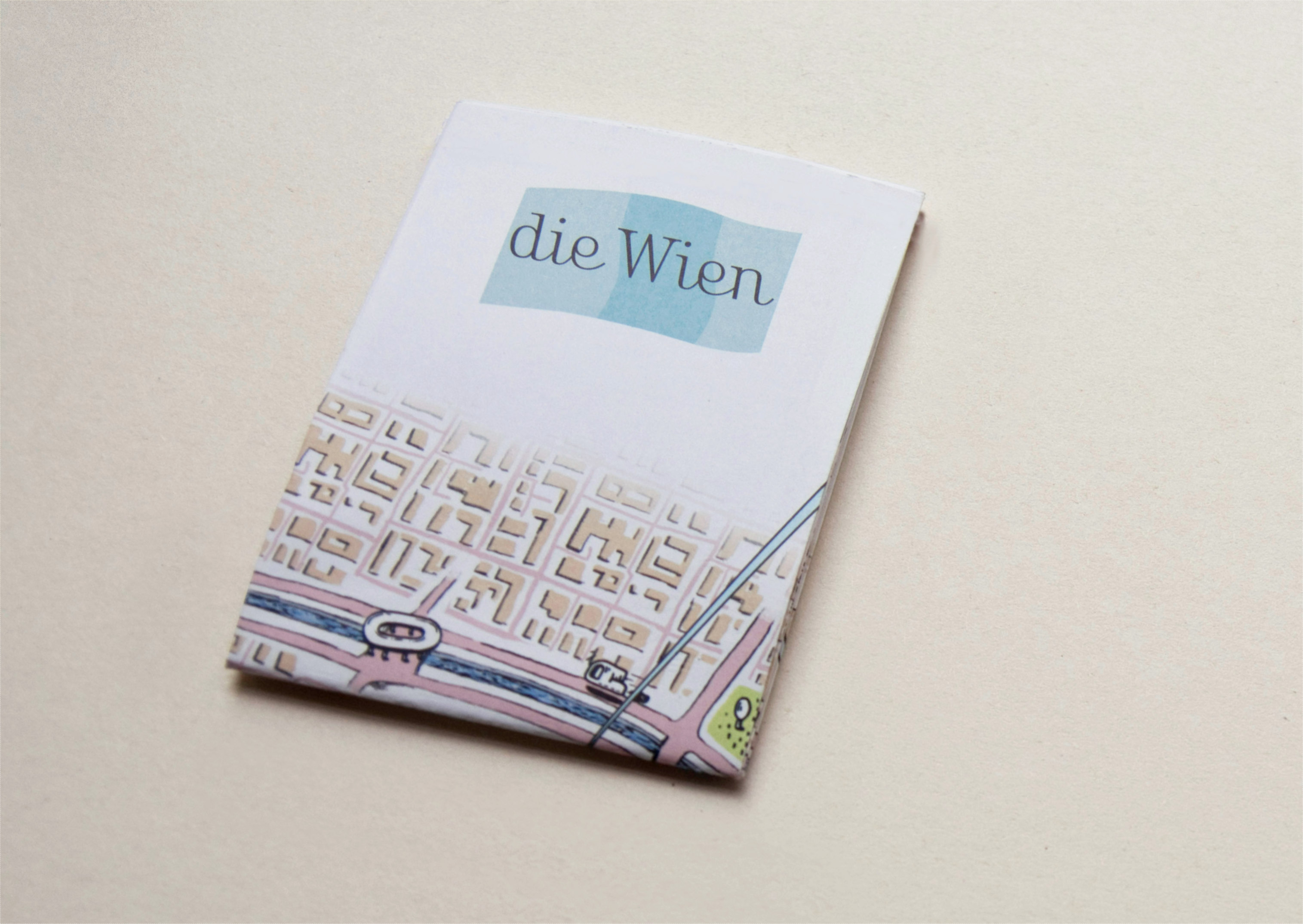 Folded illustrated city-map. Logo on cover.