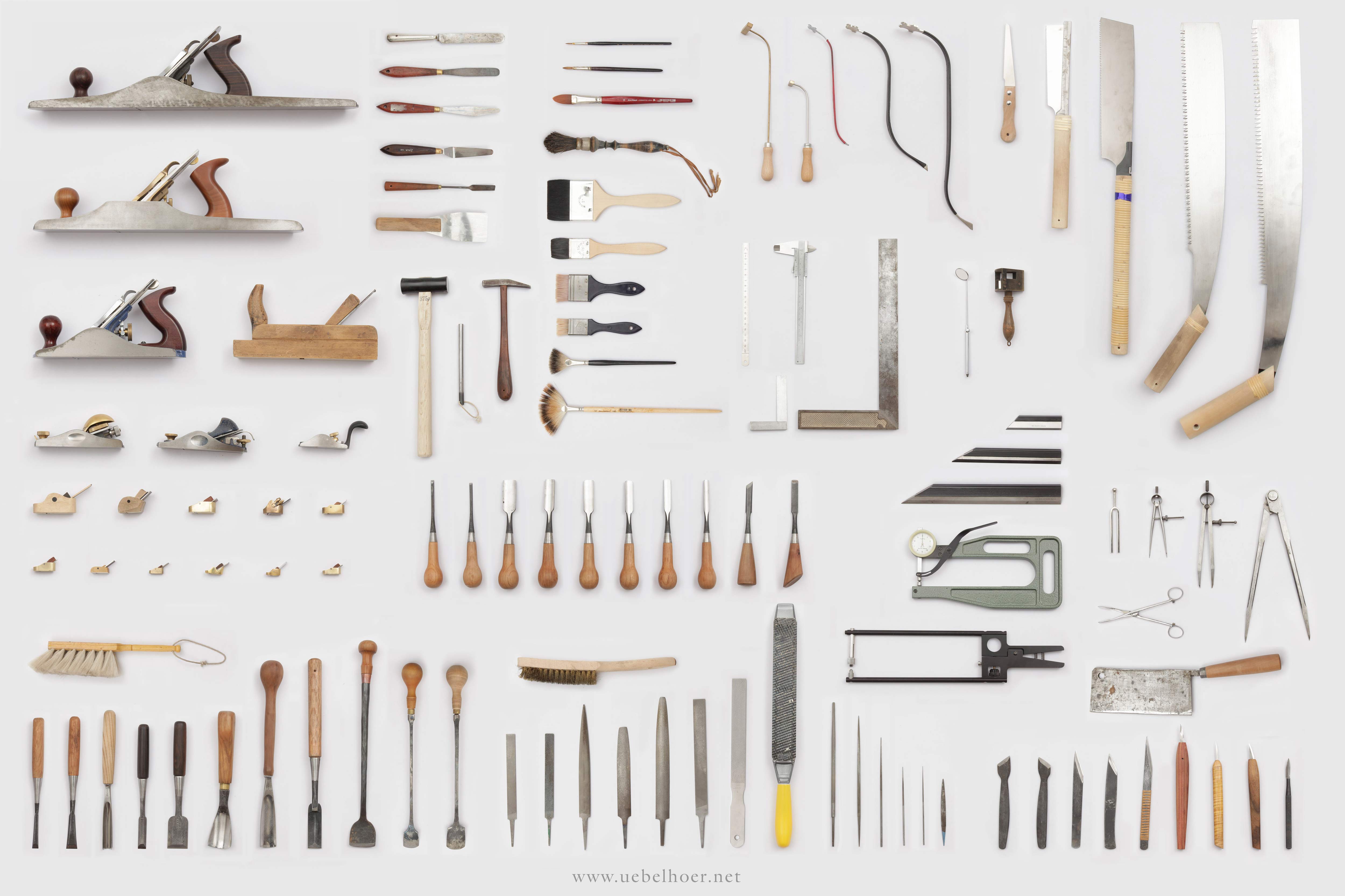 Poster showing arrangement of all tools from violin maker's workshop.