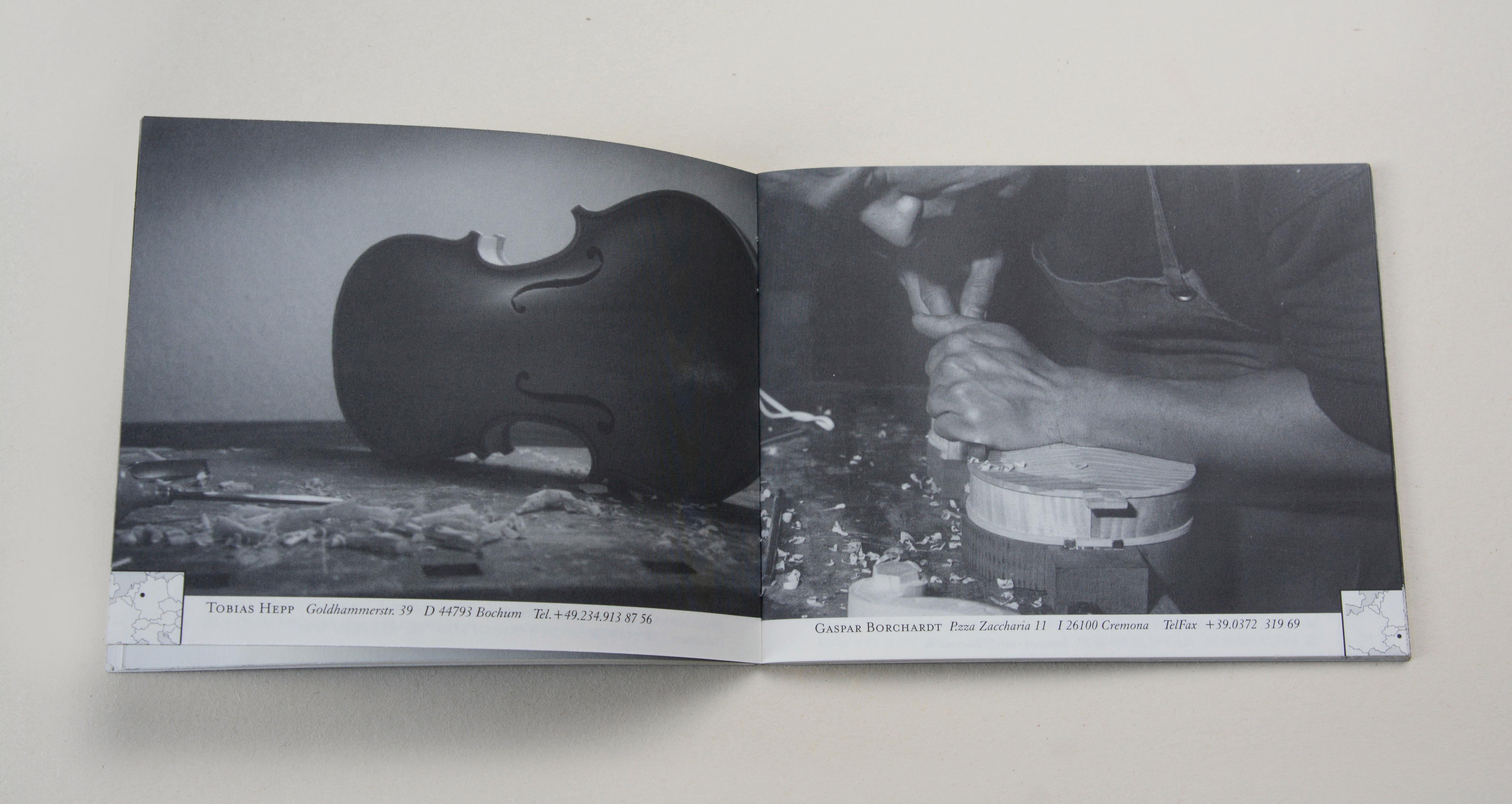 Double page. On each page full-page b/w photos. Thumbnail sized map with marking point at bottom corner. Line of small text in white space underneath. Left: Violin body on workbench. Right: Man carving on a violin body.