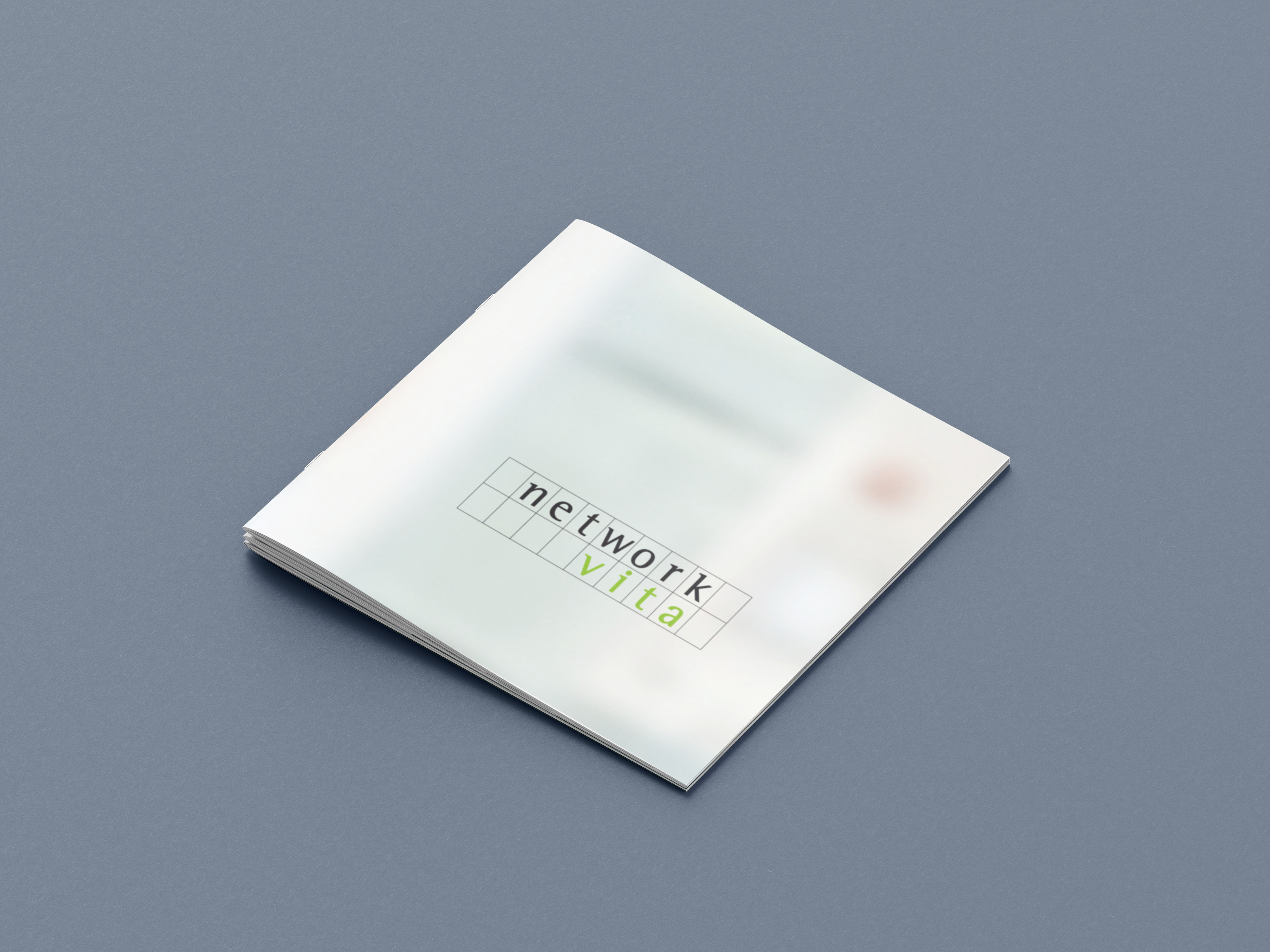 Cover Brochure. Full-page extreme blurry photo. Logo overlayed.