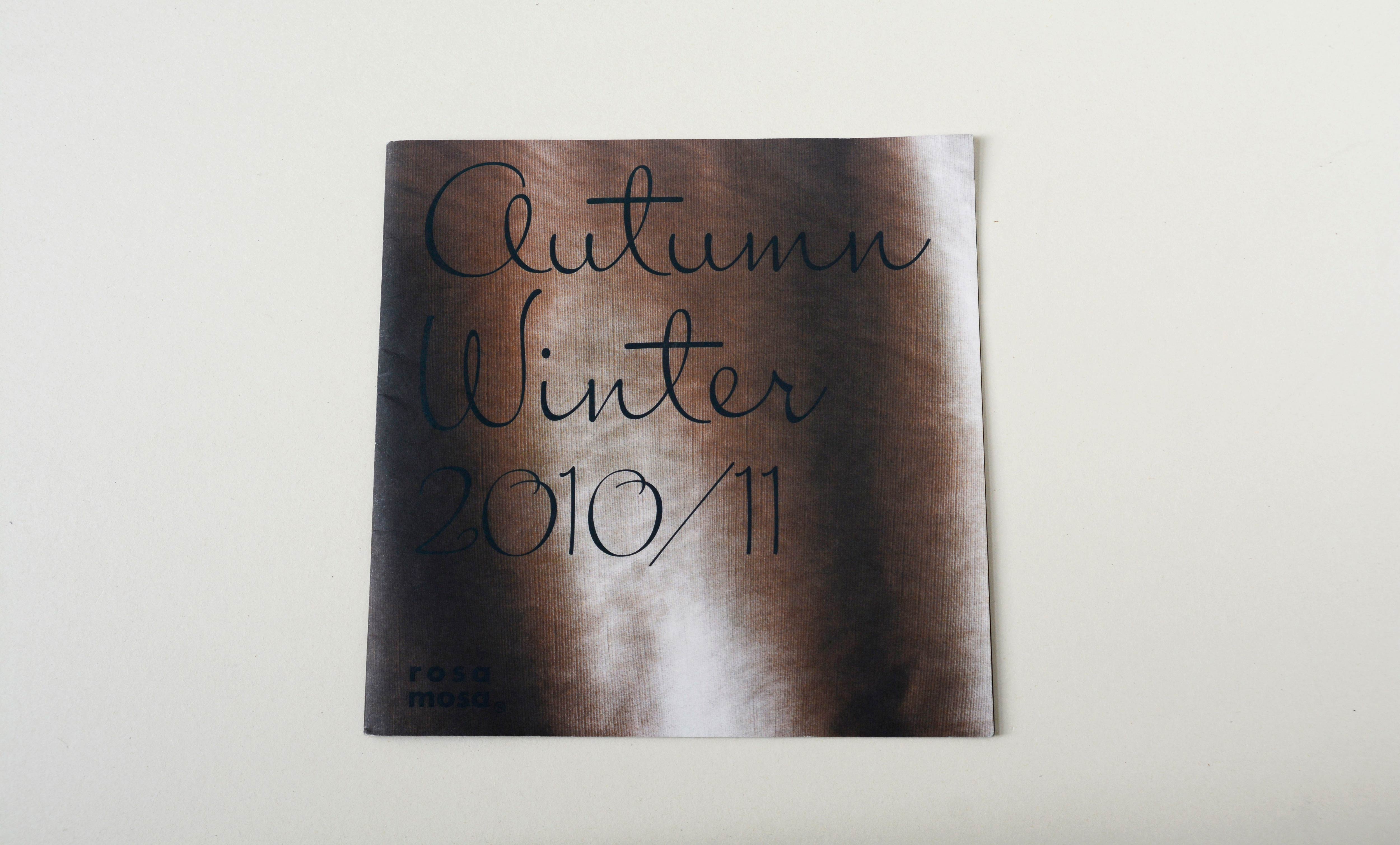 Cover Catalogue. In the background photo of fabric overlayed by title in script font.