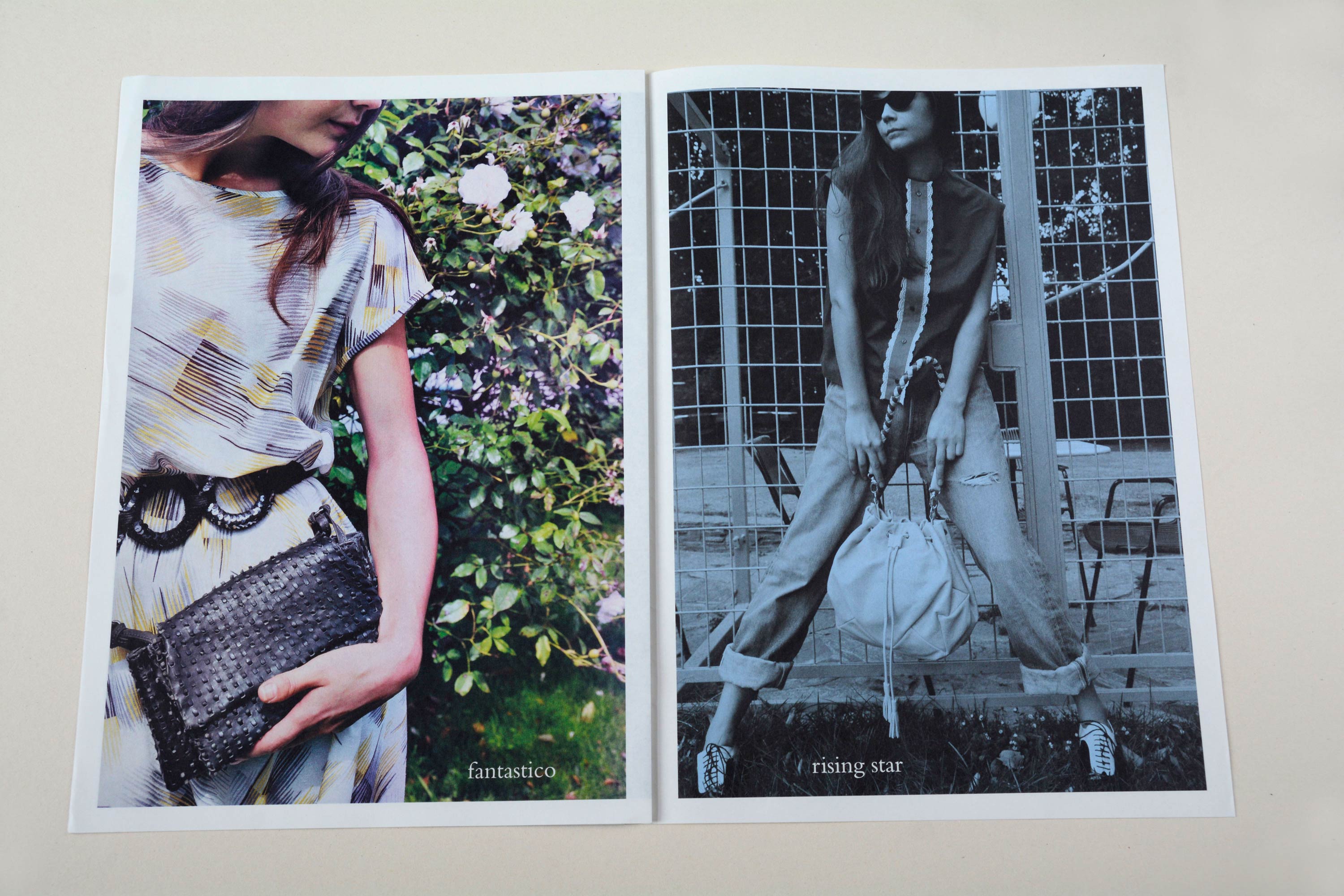 Double page. Full-page photos with white space around. Small font at bottom overlayed. Left: Close-up of woman holding handbag in front of flowering bush. Right: Woman holding handbag in front of iron grid door.