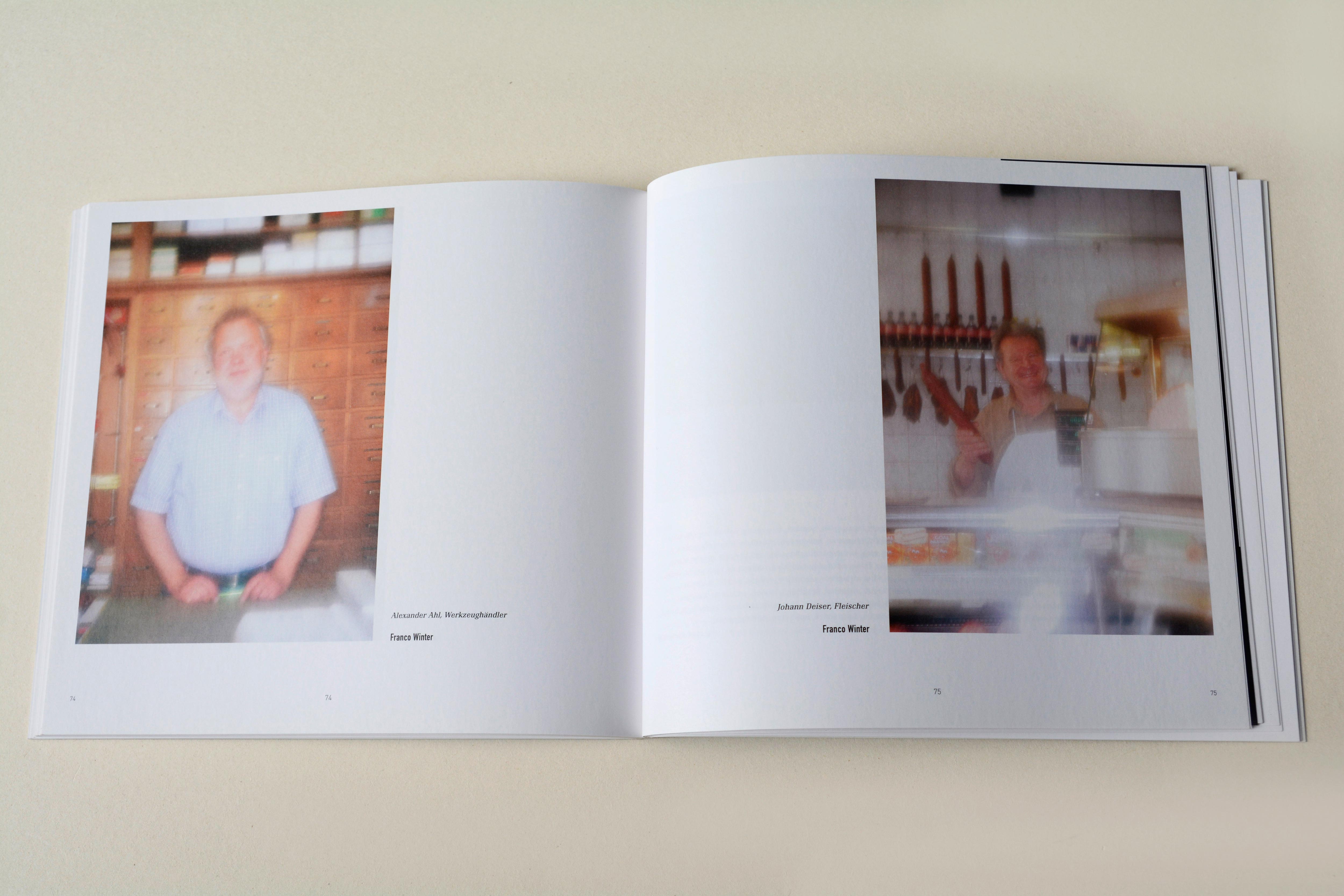 Double page. One blurry photo on each page with little text at bottom. Left: Man behind counter in an old tool store. Right: Man in behind display case in a butcher's.