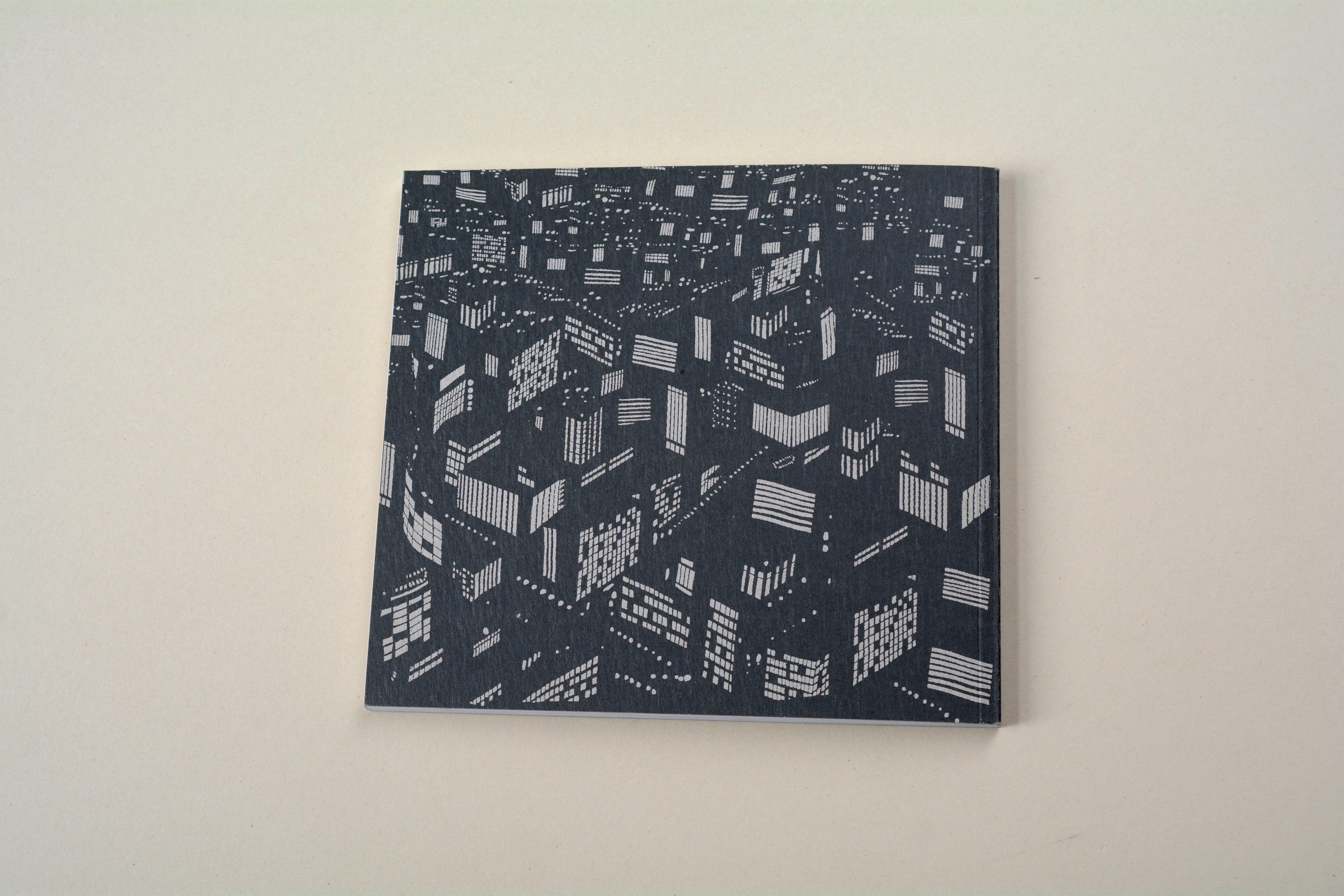 Back catalogue. B/W illustration of city at night.